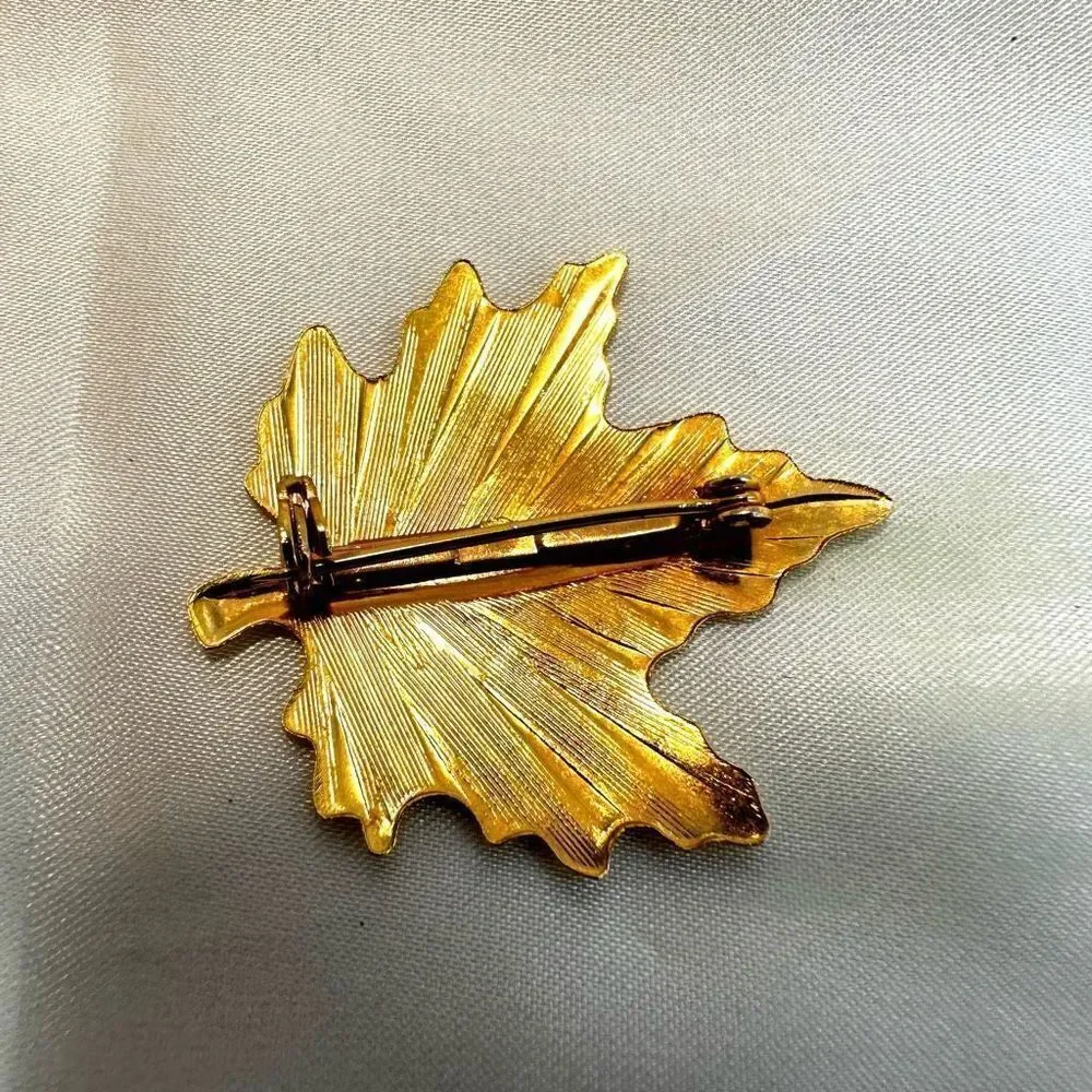 Gold tone leaf pin